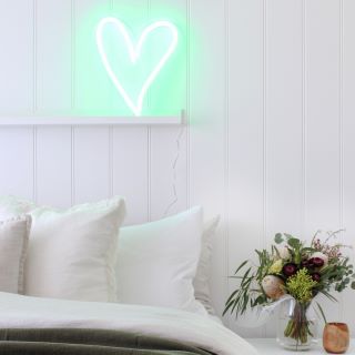 Custom Neon® mint green heart in a bedroom