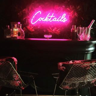 Custom Neon® pink cocktail bar sign