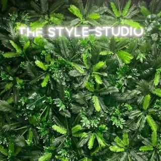 White Custom Neon® selfie sign on green wall @thestylestudiopeterborough