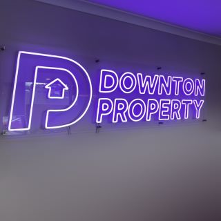 Custom Neon® purple logo sign downtonproperty.com.au
