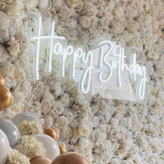 Happy Birthday sign by Custom Neon® on white floral wall @effortless_elegance_uk