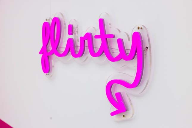 Flirty pink Custom Neon® sign made exclusively for the Love Island Australia Villa