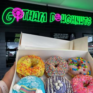 Custom Neon® green and pink store logo @gotham.doughnuts