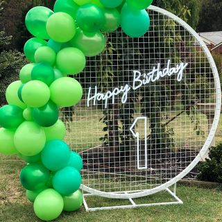 Custom Neon® Happy Birthday sign at a garden party