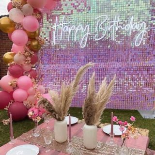 White Happy Birthday sign in an outdoor setting by Custom Neon® for @effortless_elegance_uk