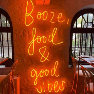 Good Food + Good People pink Custom Neon® sign on brick wall @rubis_18st