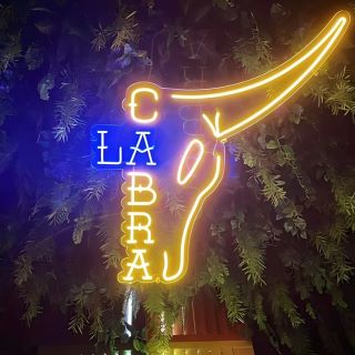 Yellow and blue steer head logo sign @lacabramexican by Custom Neon®