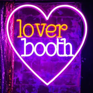 Custom Neon® purple heart logo on brick wall @loverphotobooth