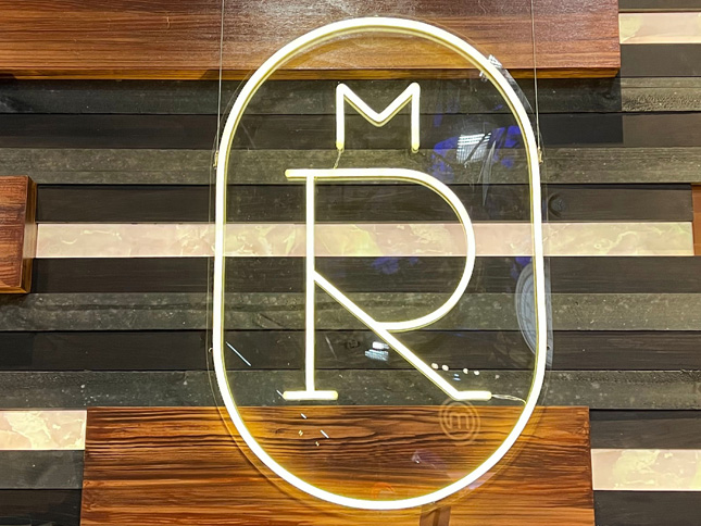 Melbourne Royal Show logo in white LED neon flex on wood panelled wall made by Custom Neon®