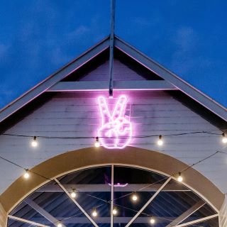 Large exterior animated peace sign @wahbar made by Custom Neon®