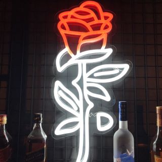 Custom Neon® red & white rose art behind a bar