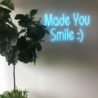Light blue Custom Neon® selfie wall sign @saxeortho