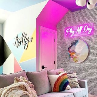Custom Neon® pink Play All Day sign in living room @shannonking_eclecticinteriors