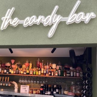 Custom Neon® white outdoor sign The Candy Bar on the roof @thebeaufortperth