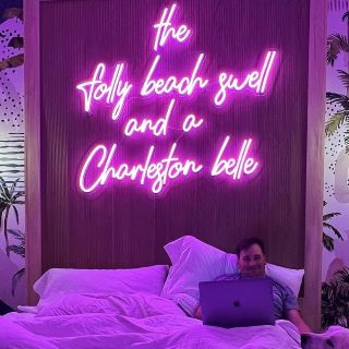 Custom Neon® pink quote sign above the bed @thejamescharleston