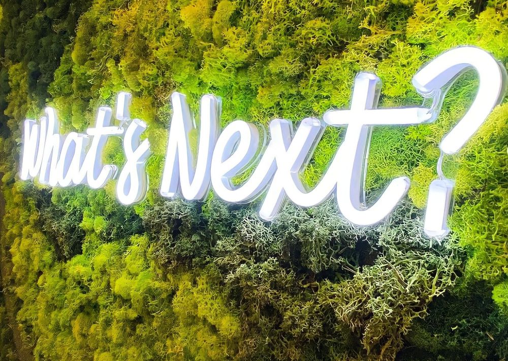 White What's Next sign @artandassoc by Custom Neon®