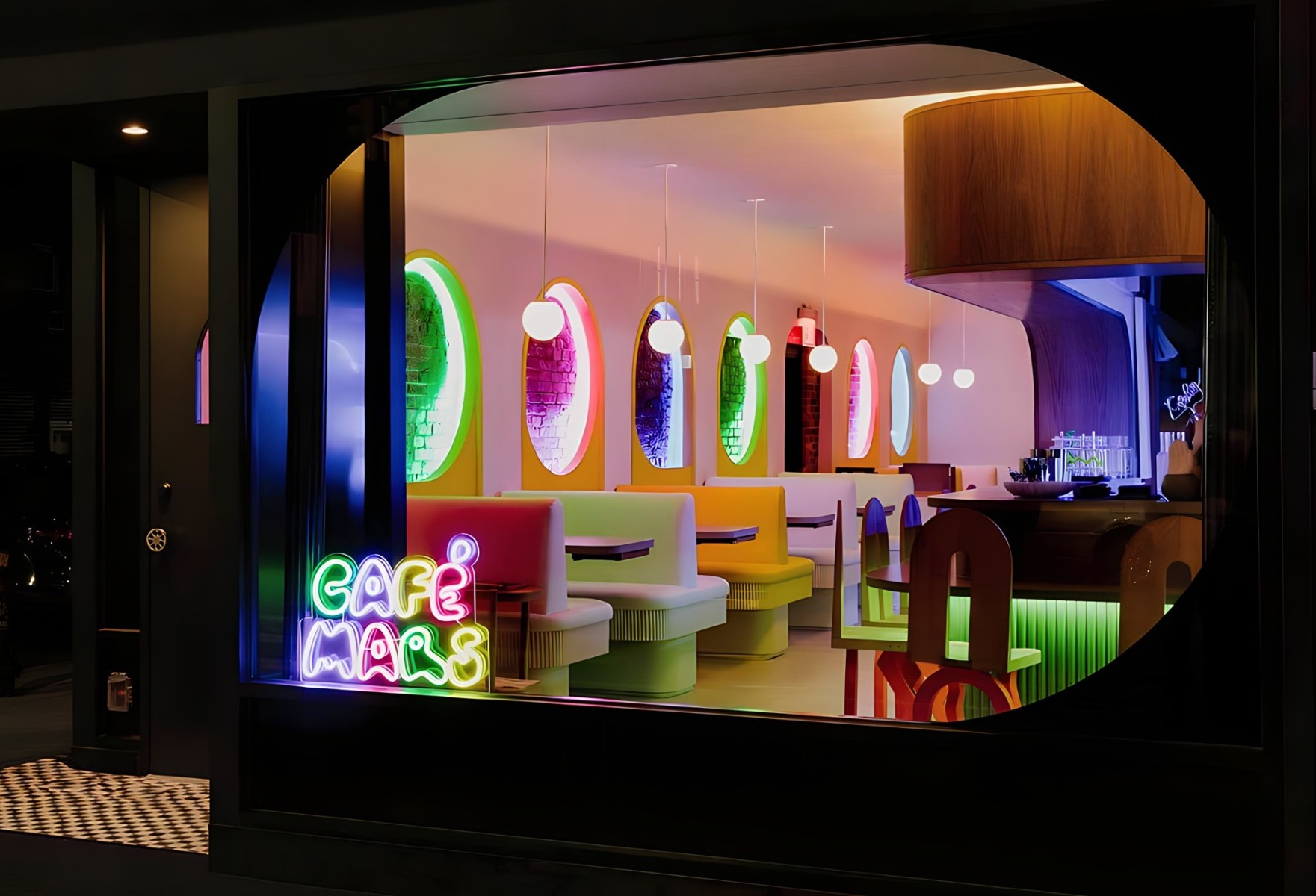 Colorful cafe name sign in the window of the Instagrammable Cafe Mars
