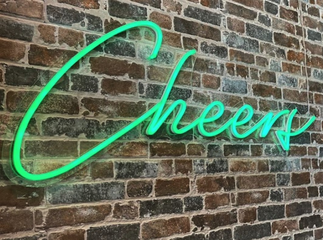 Custom Neon® green Cheers sign