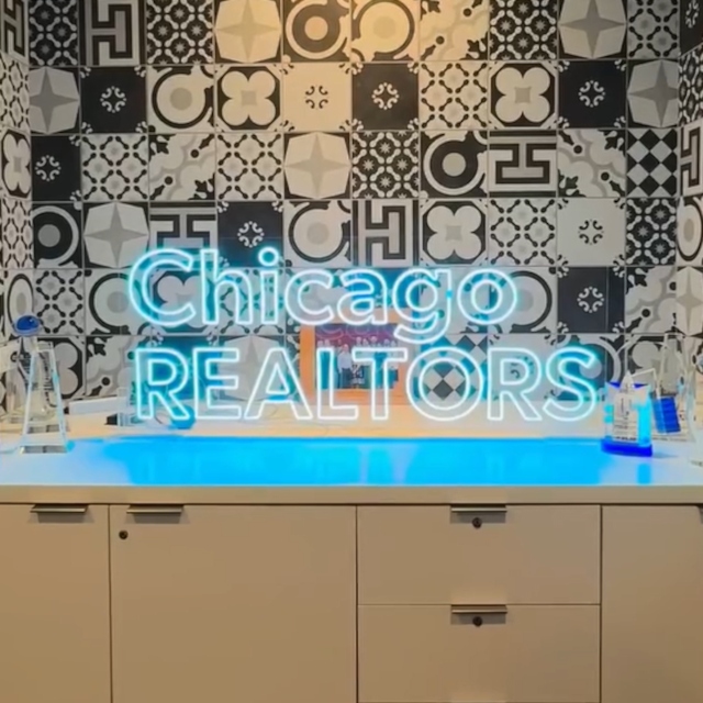 Chicago Realtors light blue Custom Neon® sign on stand