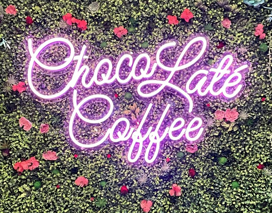 Custom Neon® pink Choco Latte Coffee sign on greenwall mychocolatecoffee.com/