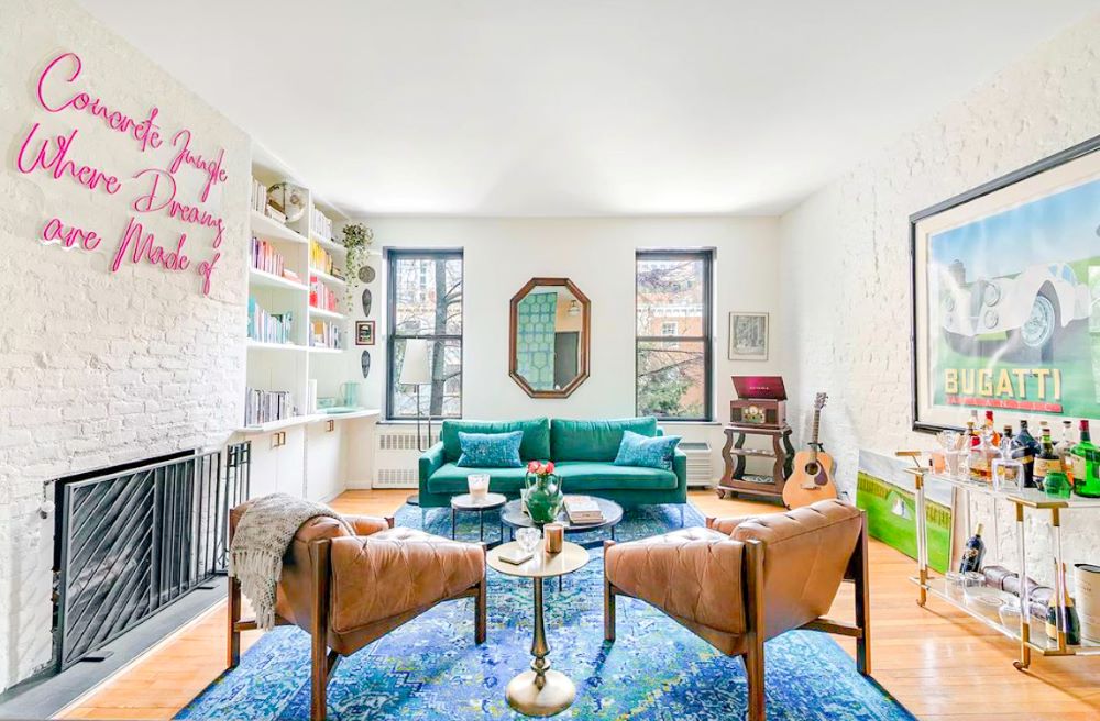 Pink 'Concrete Jungle Where Dreams Are Made of' neon word sign in living room @therathproject by Custom Neon®