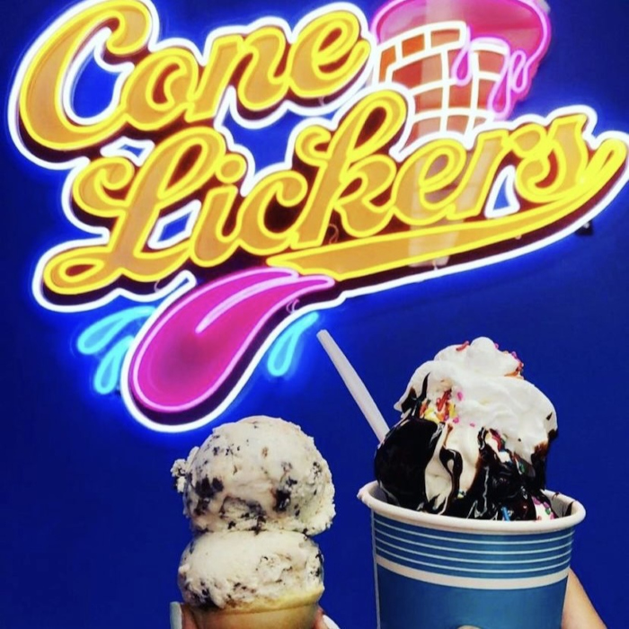 Custom Neon® LED neon & UV print ice cream parlor sign on deep blue wall