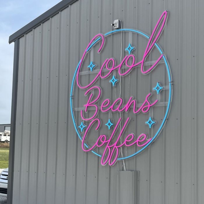 Pink & blue outdoor Custom Neon® sign on the exterior of the @coolbeanscoffee house