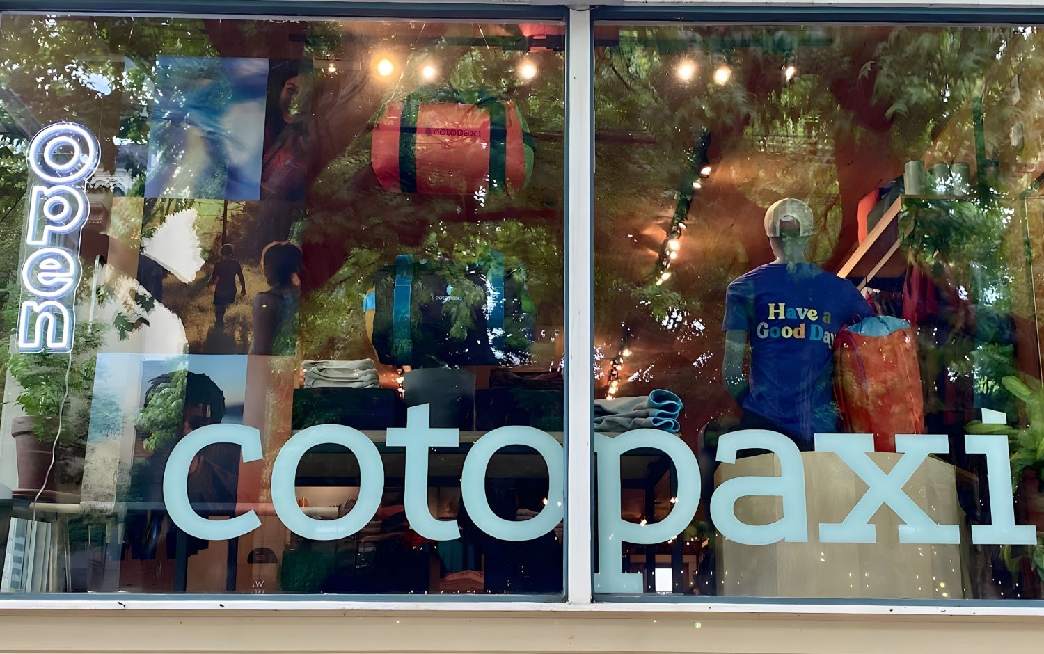 Custom Neon® open sign in the window @cotopaxi PDX