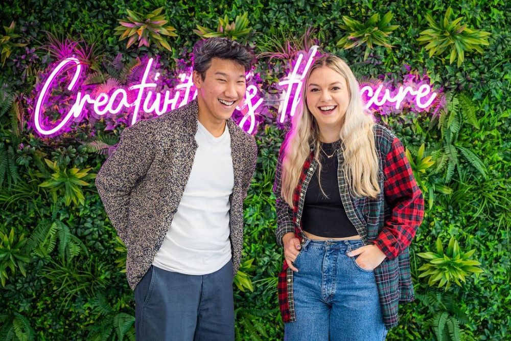 Creativity is the Cure Custom Neon® office slogan selfie sign on greenwall @create_bristol