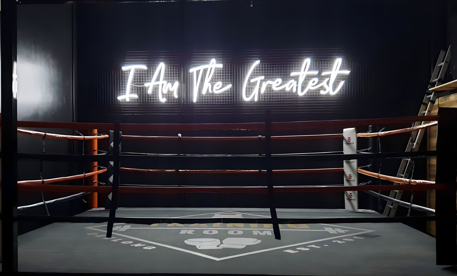 I Am The Greatest white Custom Neon® sign behind boxing ring @thetrainingroomgeelong