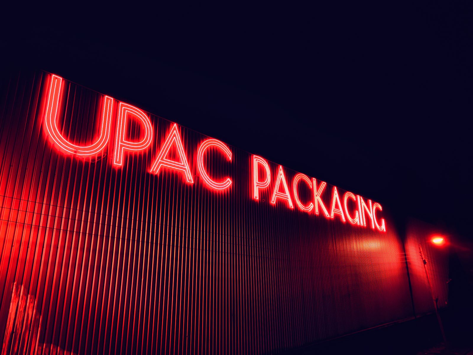 88ft long Custom Neon® exterior building sign @theupacgroup