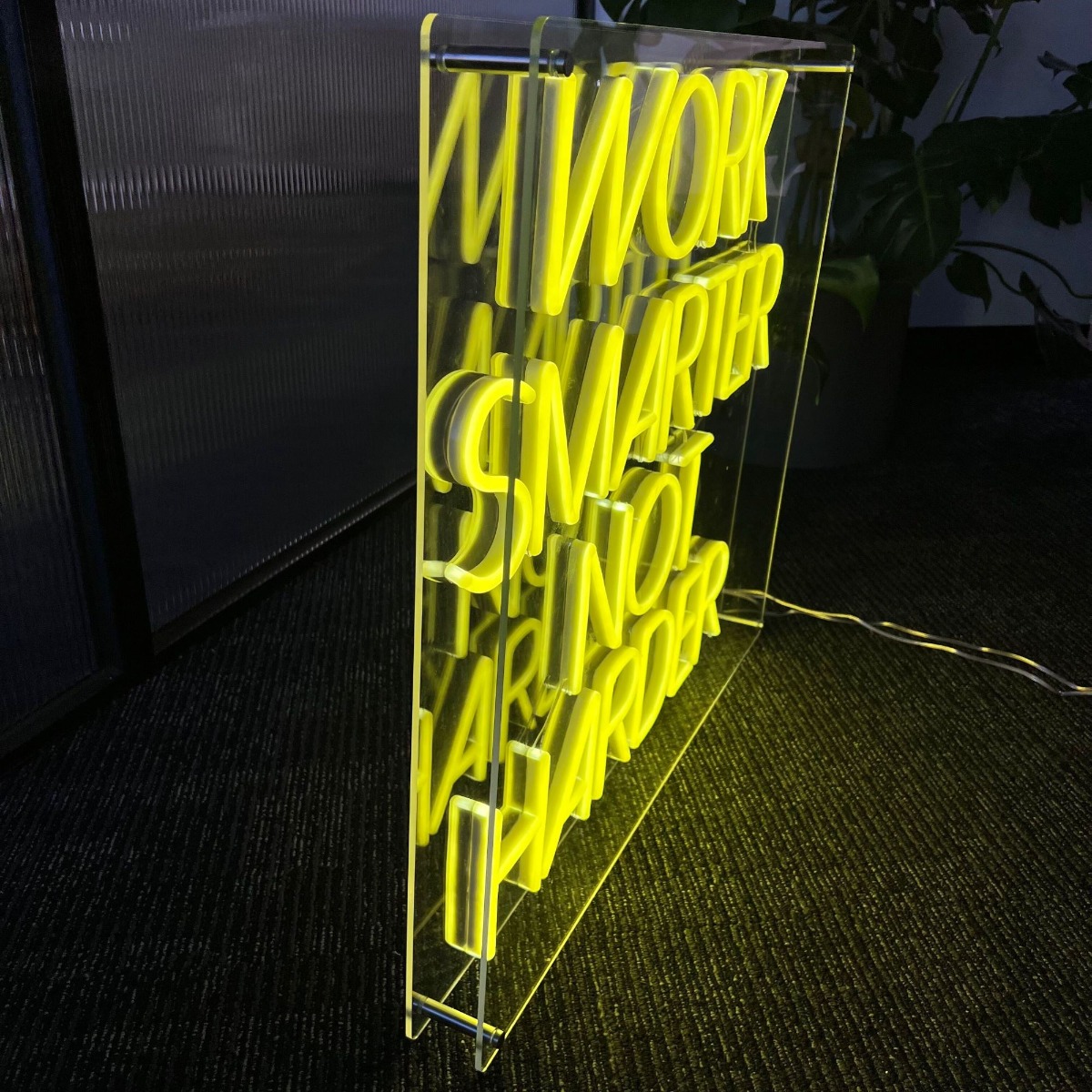 Custom Neon® free-standing sign in an acrylic open box