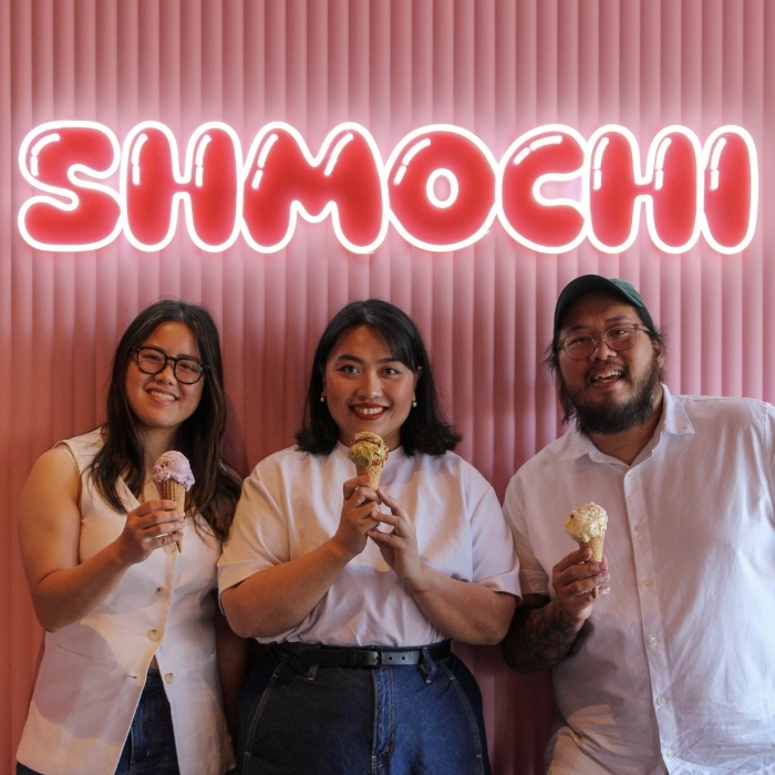 Red and white Shmochi retail logo sign by Custo Neon