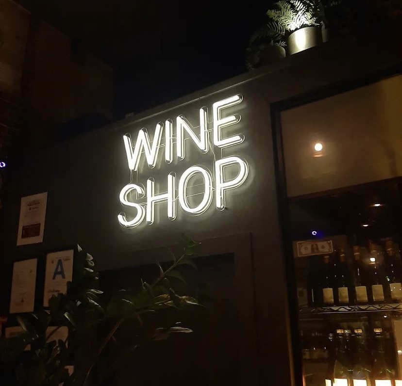 White Custom Neon® sign @tabularasabar wine shop