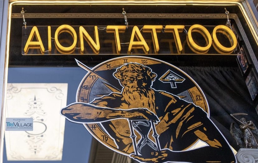 Yellow window sign made by Custom Neon® for @aiontattoo
