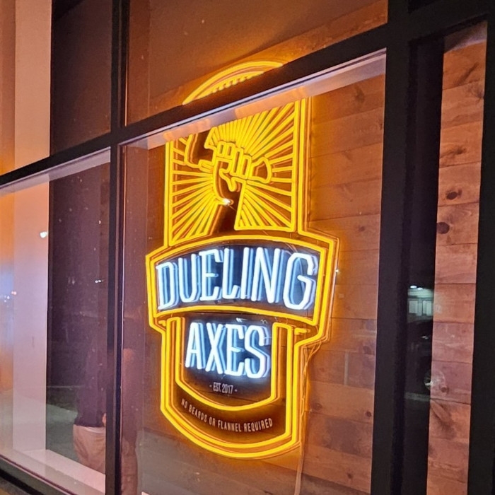 Storefront window logo sign by Custom Neon® @duelingaxes