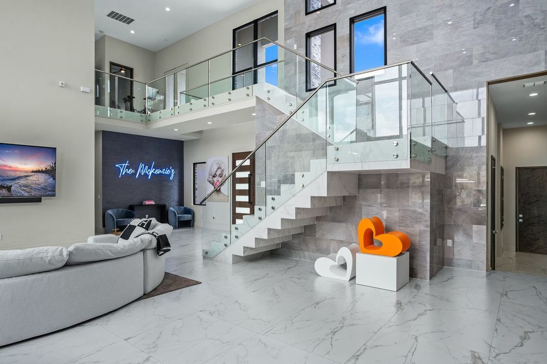 Blue Custom Neon® family name sign in home designed by @etudestudios