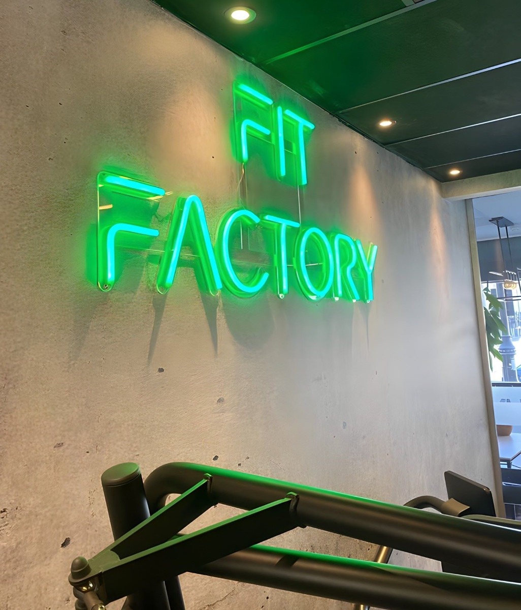 Custom Neon® dark green wall sign @retrofitlondon