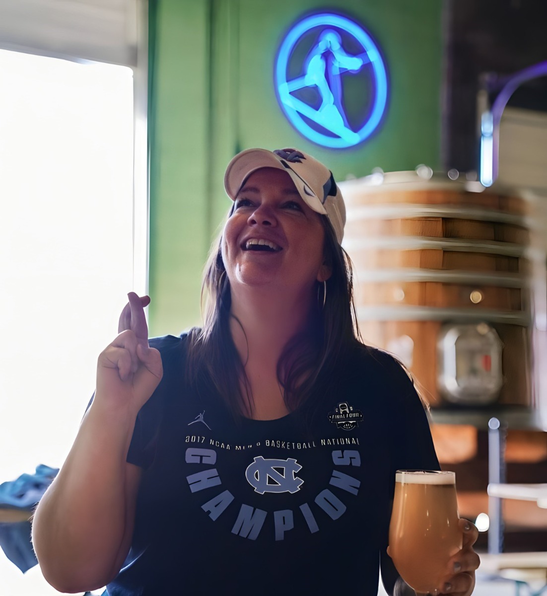 Custom Neon® blue @hiwirebrewing logo on the wall at the @hiwirebrewing_durm Durham, NC taphouse