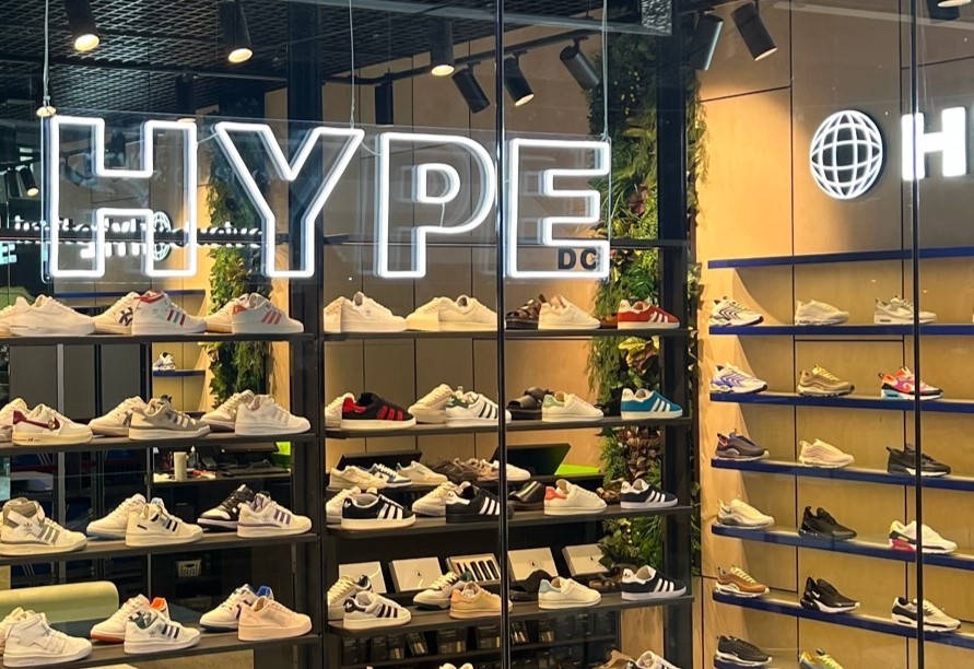 Custom Neon® storefront sign hung from the ceiling @hypedc