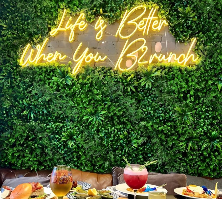 Life is better when you brunch yellow Custom Neon® sign on greenwall @brunchharlem