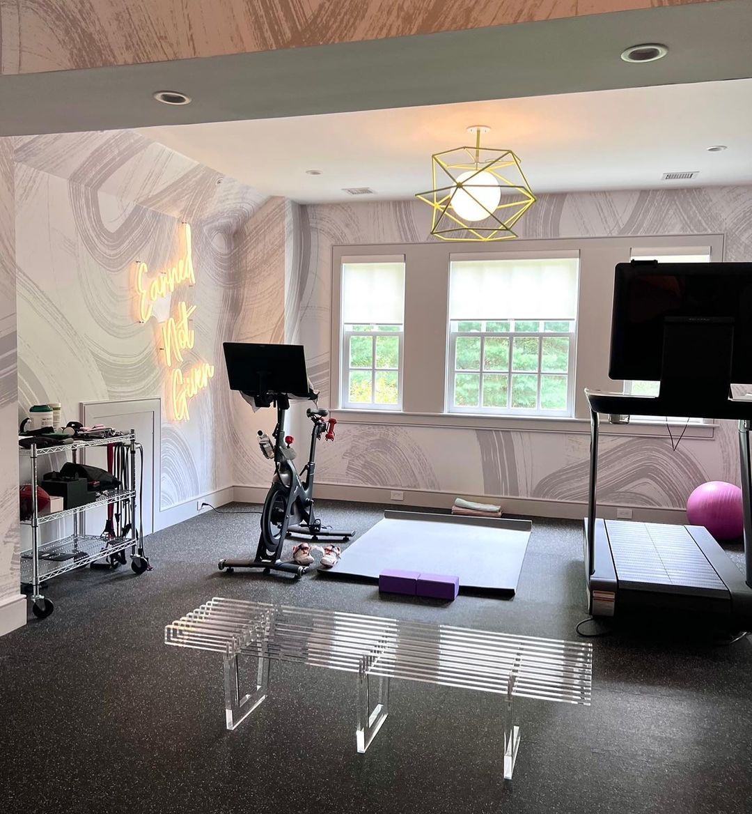Custom Neon® Earned Not Given quote sign in home gym designed by @lkateinteriors