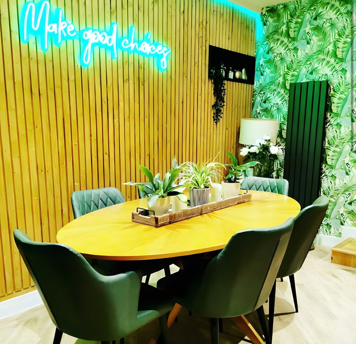Make Good Choices green Custom Neon® sign on wood-panelled dining room wall @renovationcation