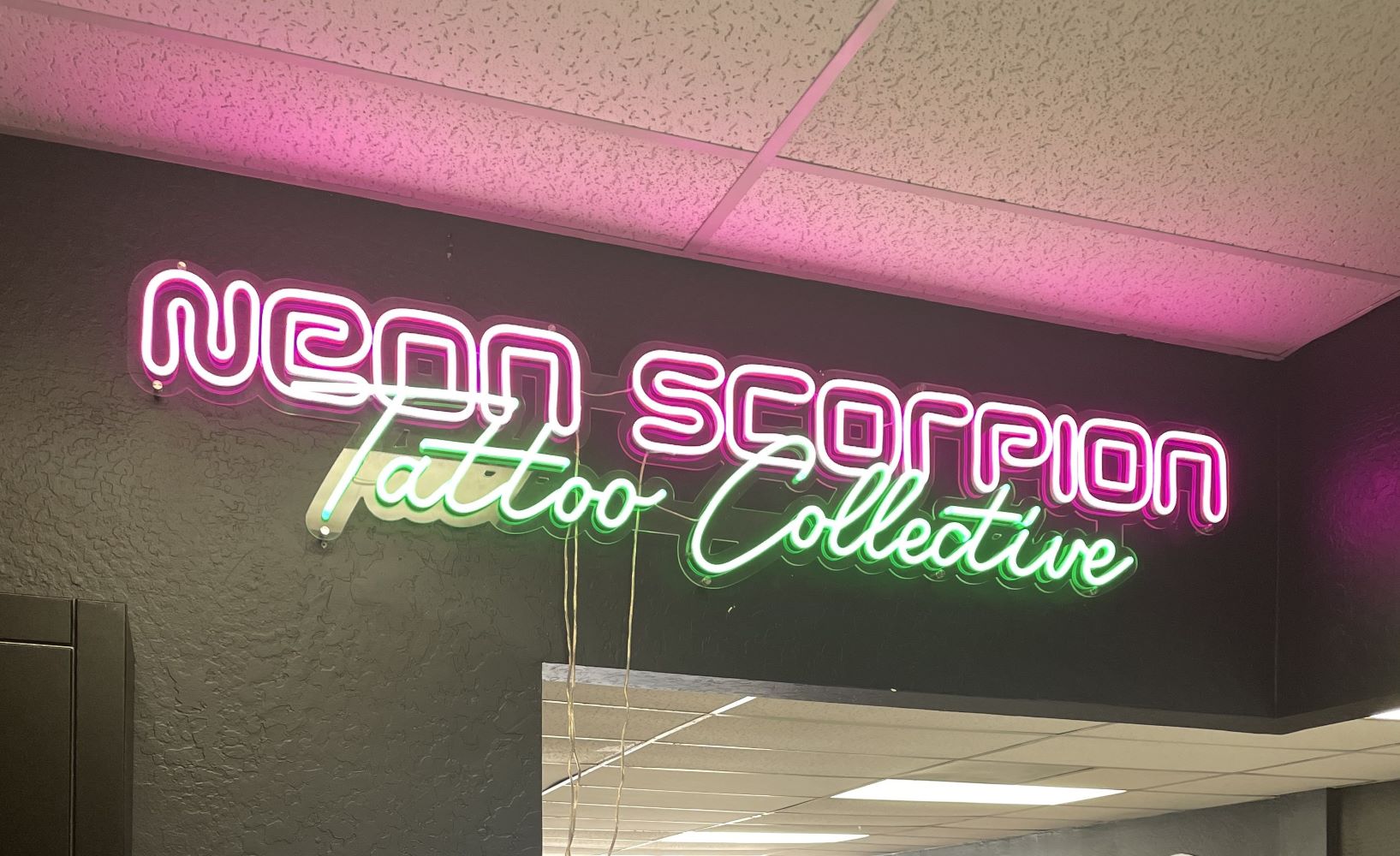 Custom Neon® green & pink logo @neonscorpiontattoo