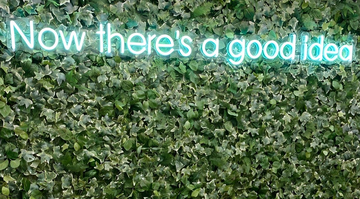 Custom Neon® Now There's a Good Idea mint colored office sign on greenwall @hrocgroup