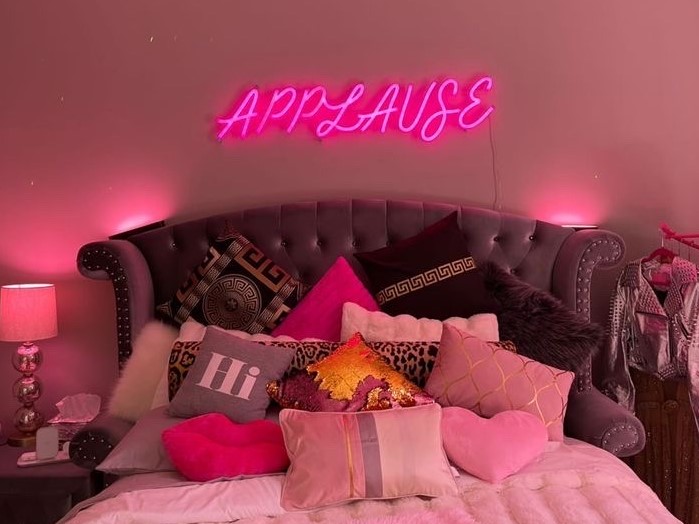 Pink Custom Neon® sign above a bed @seanapplause