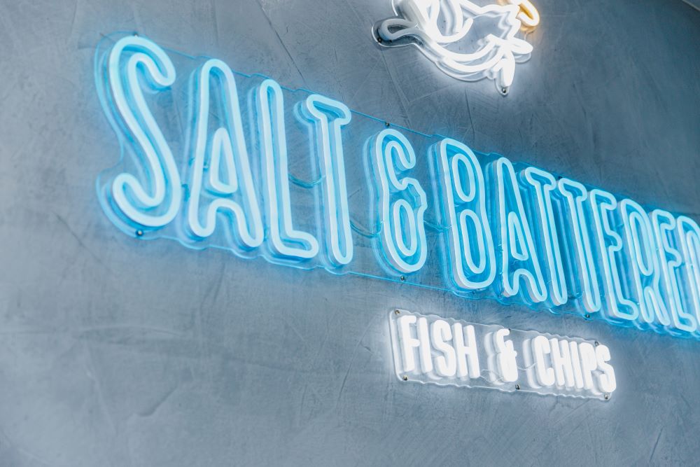 Salt & Battered color changing Custom Neon® RGB sign on light blue