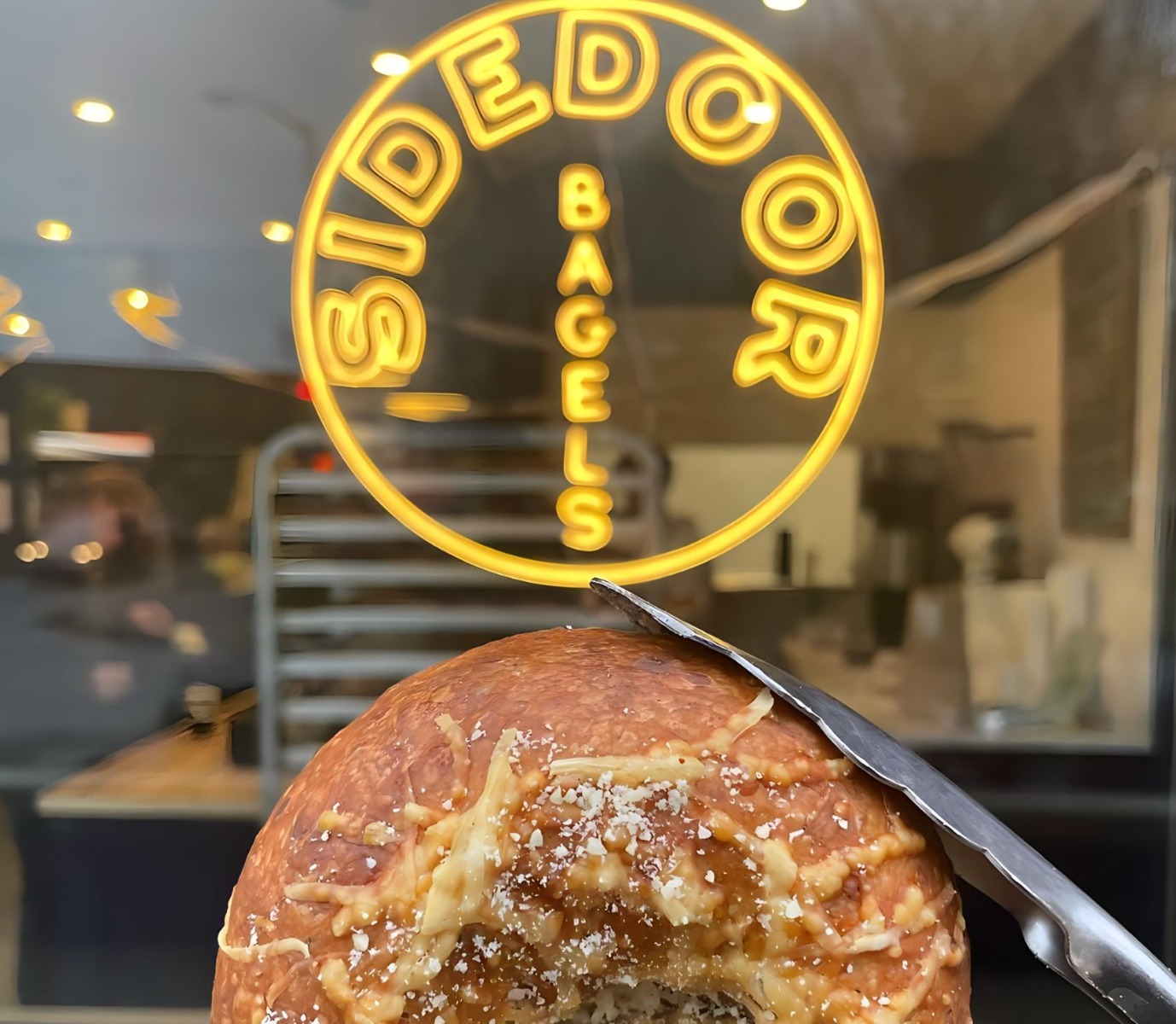 Custom Neon® logo sign in the window @sidedoorbagel