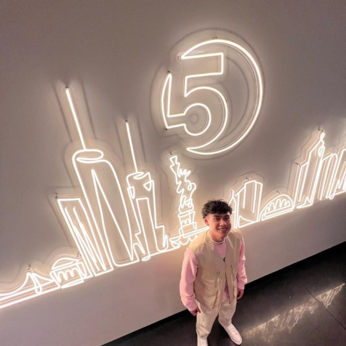 Custom Neon® Large warm white LED neon NYC skyline artwork on a white wall @5boroughbagels