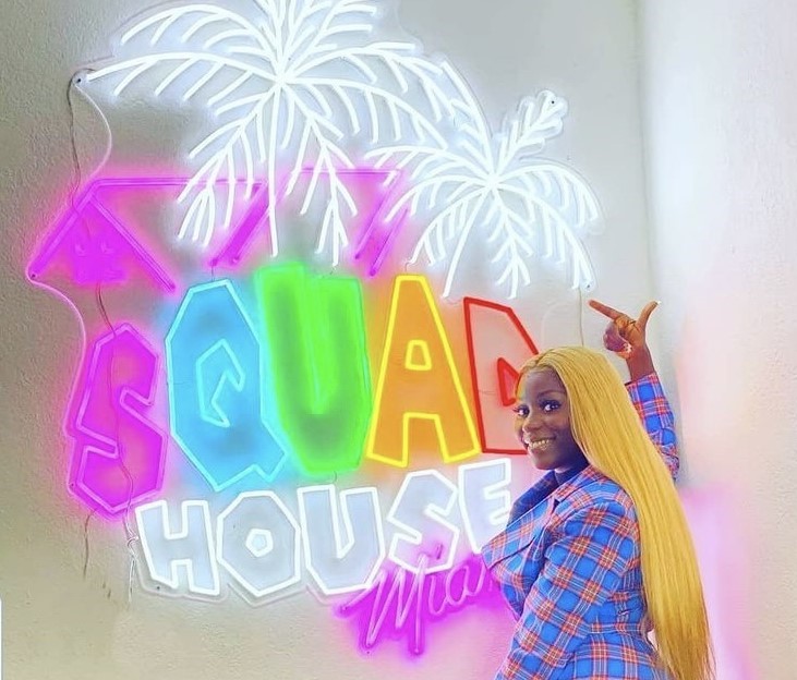Custom Neon® colorful social media channel logo @squadhouse